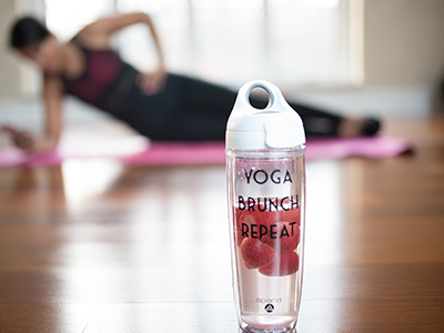 A woman is doing yoga on the floor